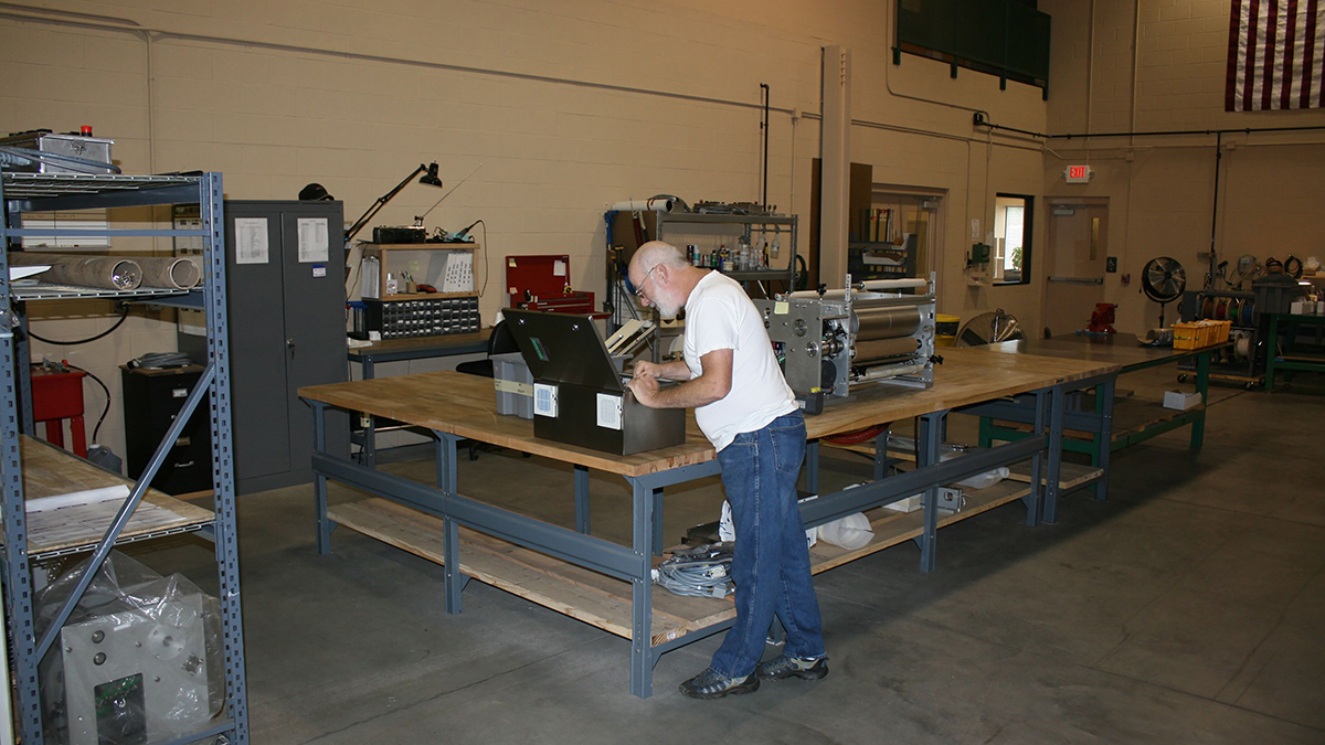 Print technician servicing a printer